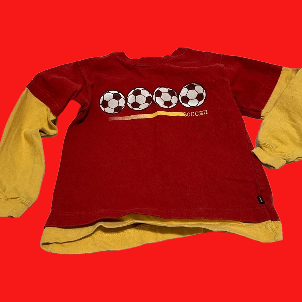 Boys long sleeved soccer tee by Carters, size 6, 45-49 lbs. Red/mustard yellow.